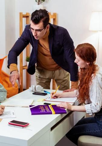 itelligent handsome man pointing with his hand