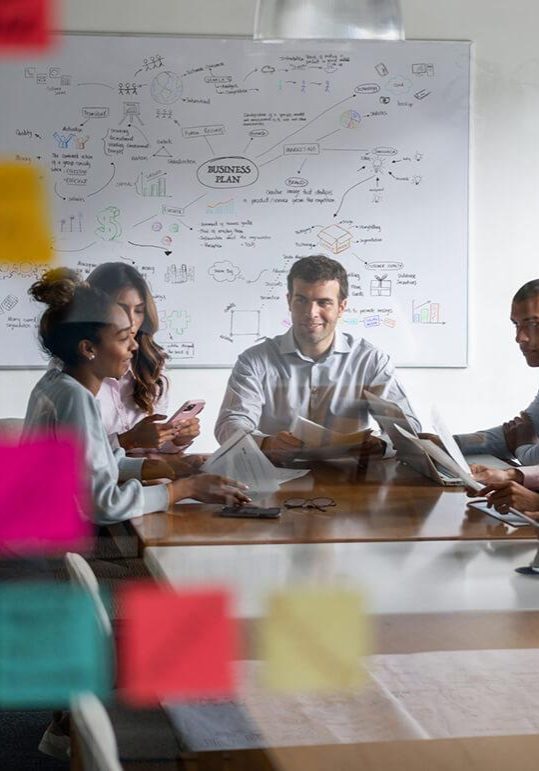 people in a business meeting planning their systems of learning people in a business meeting planning their systems of learning